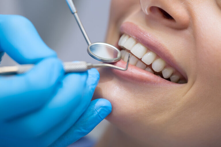 a dentist checking a patients teeth