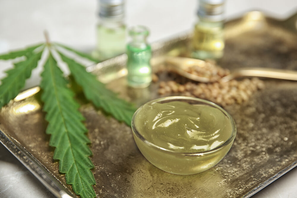 close up of cannabis lotion in glass jar