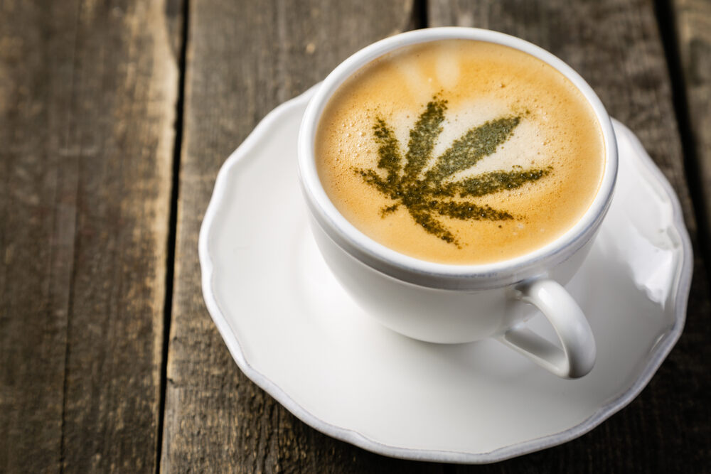 coffee in a cup with marijuana leaf