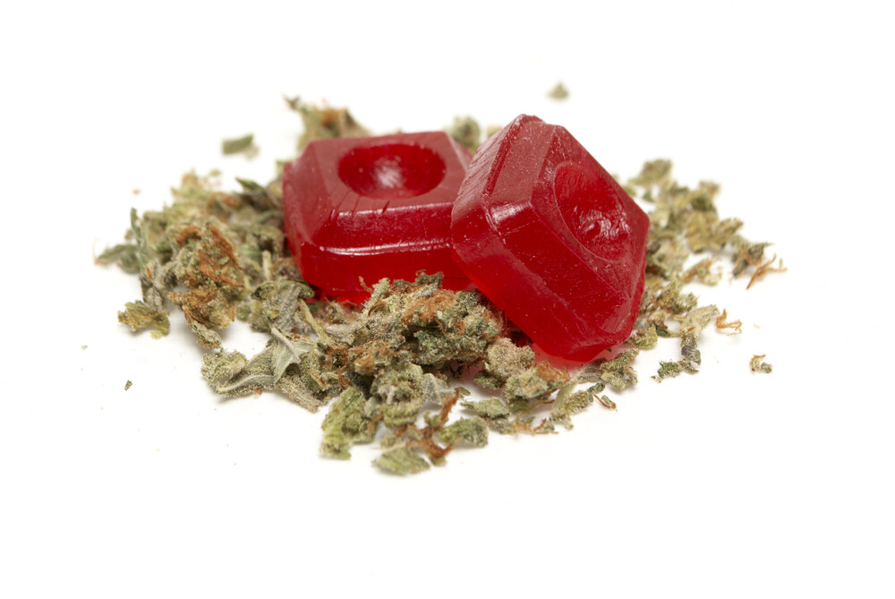 hard cannabis candy on top of cannabis buds